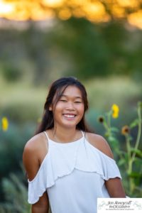 Littleton high school senior photographer Arapahoe Centennial Colorado Carson Nature Center Class of 2022 summer light sunset sunflowers beautiful girl natural light photography