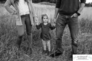 Littleton family photographer South Valley Open Space park Ken Caryl Colorado red rocks daughter little girl mother father guided pose snuggles sunset photography playful real moments