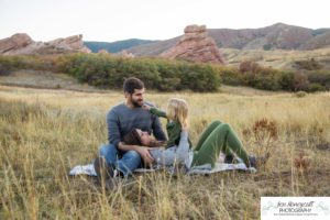 Littleton family photographer South Valley Open Space park Ken Caryl Colorado red rocks daughter little girl mother father guided pose snuggles sunset photography playful real moments