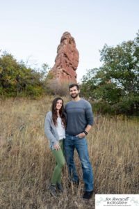 Littleton family photographer South Valley Open Space park Ken Caryl Colorado red rocks daughter little girl mother father guided pose snuggles sunset photography playful real moments