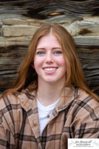 Littleton high school senior photographer Golden Clear Creek bridge Lakewood taekwondo black belt class of 2022 fall leaves photography red head girl