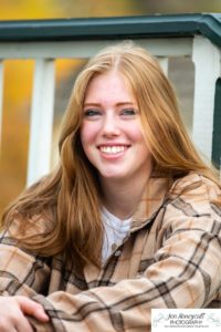 Littleton high school senior photographer Golden Clear Creek bridge Lakewood taekwondo black belt class of 2022 fall leaves photography red head girl