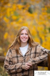 Littleton high school senior photographer Golden Clear Creek bridge Lakewood taekwondo black belt class of 2022 fall leaves photography