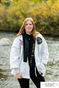 Littleton high school senior photographer Golden Clear Creek bridge Lakewood taekwondo black belt class of 2022 fall leaves photography