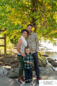 Littleton family photographer extended grandparents cousins Golden Clear Creek area yellow leaves trees water old buildings morning light photography