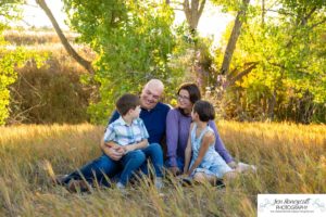 Littleton family photographer Standley Lake Colorado yellow trees leaves fall brother sister beach sand love sunset photography Halloween