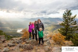 Littleton family photographer mountain camping views Evergreen firepit smores kids roasting marshmallows branding photo session outdoors tent ramble photography