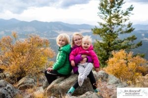 Littleton family photographer mountain camping views Evergreen firepit smores kids roasting marshmallows branding photo session outdoors tent ramble photography