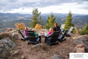 Littleton family photographer mountain camping views Evergreen firepit smores kids roasting marshmallows branding photo session outdoors tent ramble photography