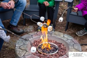 Littleton family photographer mountain camping views Evergreen firepit smores kids roasting marshmallows branding photo session outdoors tent ramble photography