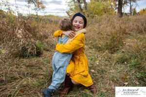 Littleton family photographer McKay Lake Colorado fall photography grandparents grandchildren dog extended baby sisters hug