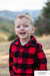 Littleton family photographer Colorado Mt. Falcon park cold wind little boy mountain view fun moments parenthood sunset photography sweet child