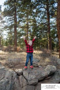 Littleton family photographer Colorado Mt. Falcon park cold wind little boy mountain view fun moments parenthood sunset photography sweet child