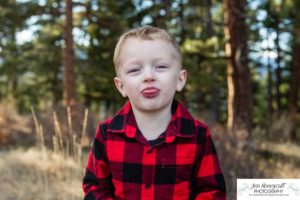 Littleton family photographer Colorado Mt. Falcon park cold wind little boy mountain view fun moments parenthood sunset photography sweet child