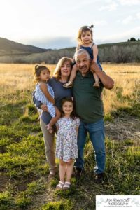 Littleton family photographer extended grandparents grandchildren Hildebrand Ranch little girls cousins kids daughter sisters foothills sunset photography