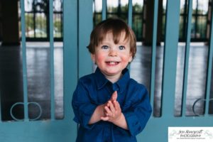 Littleton family photographer Denver City park toddler boy boathouse mother father son spring Colorado photography trees bloom