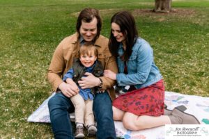 Littleton family photographer Denver City park toddler boy boathouse mother father son spring Colorado photography trees bloom