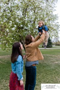 Littleton family photographer Denver City park toddler boy boathouse mother father son spring Colorado photography trees bloom