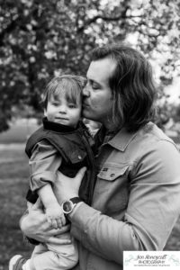 Littleton family photographer Denver City park toddler boy boathouse mother father son spring Colorado photography trees bloom