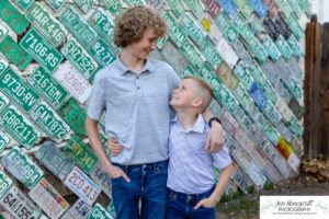 Littleton family photographer Morrison urban photo session boys brothers mother father sons bridge license plate wall photography sunset spring Colorado river