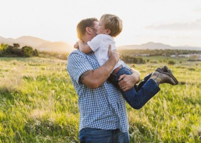 Littleton family and newborn baby photographer mini photo session sunset summer photography big brother little sister mother father son daughter infant cuddles snuggles sun flare kids