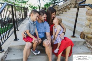 Littleton family photographer Downtown Golden urban photo session big brother little sister mother father son daughter fourth of July photography summer hot siblings snuggles real moments Colorado