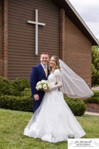 Littleton wedding photographer Arvada Baptist church photography bride and groom dress bridesmaids groomsmen flower girls reception