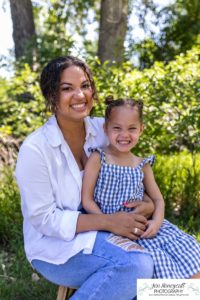 Littleton family photographer sisters Fly'N B park in Highlands Ranch Colorado girls mother father log trees morning photo session photography