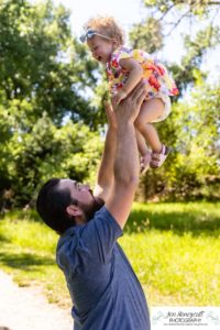 Littleton family photographer sisters Fly'N B park in Highlands Ranch Colorado girls mother father log trees morning photo session photography