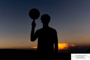 Littleton high school senior photographer and family photography portrait photo session Morrison Dakota Ridge basketball boy sunset red rocks brothers mother father sons river urban nature bridge