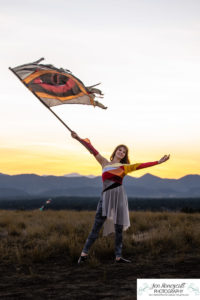 Littleton high school senior photographer color guard Heritage Class of 2023 girl teen water photography sunset mountain foothills views