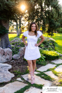 Littleton high school senior photographer Highlands Ranch Mansion Fly'N B park teen girl photography class of 2023 graduate cap and gown Mountain Vista sunset