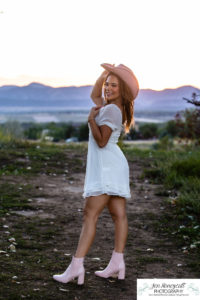 Littleton high school senior photographer Highlands Ranch Mansion Fly'N B park teen girl photography class of 2023 graduate cap and gown Mountain Vista sunset