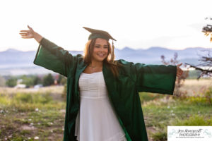 Littleton high school senior photographer Highlands Ranch Mansion Fly'N B park teen girl photography class of 2023 graduate cap and gown Mountain Vista sunset