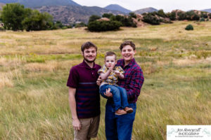 Littleton family photographer extended grandparents grandchildren red rocks Ken Caryl Valley siblings brothers boys photography sunset Colorado foothills