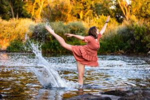 Littleton high school senior photographer color guard Heritage Class of 2023 girl teen water photography sunset mountain foothills views