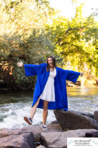 Littleton high school senior photographer class of 2023 SkyView Academy Highlands Ranch Golden Colorado teen girl cap and gown graduate river creek photography