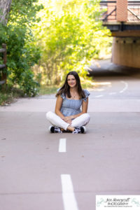 Littleton high school senior photographer class of 2023 SkyView Academy Highlands Ranch Golden Colorado teen girl cap and gown graduate river creek photography