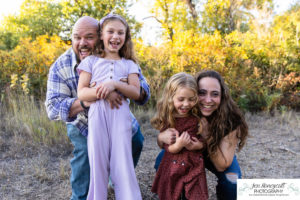 Littleton family photographer Harriman Lake Lakewood fall photography sunset sibling sisters cute kids beach water Colorado