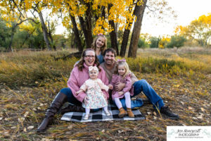 Littleton family photographer Stone House Lakewood greenbelt sunset photography fall leaves trees little girls sisters siblings bridge log cuddles one year old