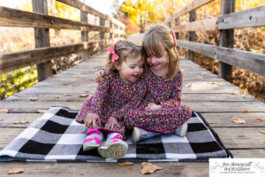 Littleton family photographer sisters girls Writer's Vista park photography wooden bridge fall leaves Highline Trail