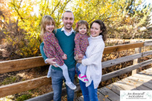 Littleton family photographer sisters girls Writer's Vista park photography wooden bridge fall leaves Highline Trail