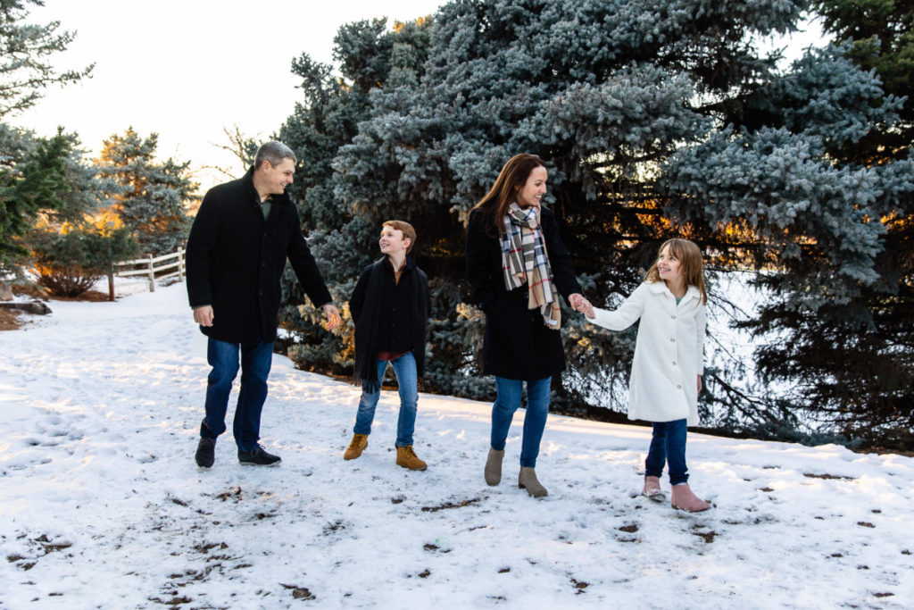 Littleton family photographer siblings urban snow pine trees brick walls brother sister sunset photography historic downtown winter coats