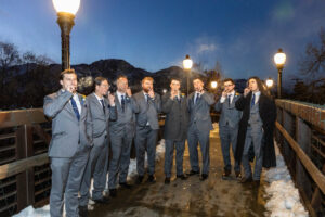 Littleton wedding photographer groomsmen cigars winter bridge Colorado outdoors photography ceremony friends