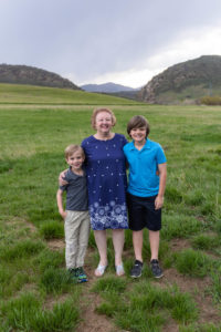 Littleton family photographer extended group grandkids grandmother grandchildren cousins brothers siblings Hildebrand Ranch Colorado foothills sunset photo session