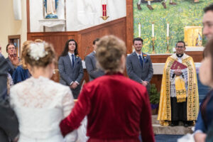 Littleton wedding photographer Catholic ceremony church snow winter bride groom marriage photography