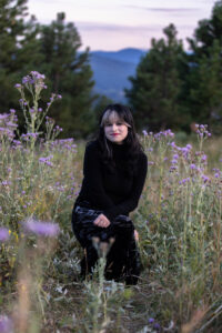 Littleton high school senior photographer teen girl Arvada West class of 2024 Mt. Falcon park Colorado wildflowers mountain view foothills photography sunset