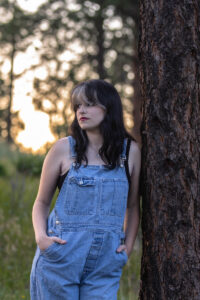 Littleton high school senior photographer teen girl Arvada West class of 2024 Mt. Falcon park Colorado wildflowers mountain view foothills photography sunset