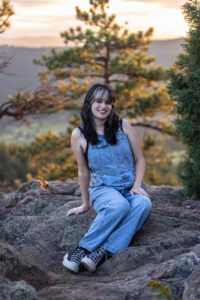 Littleton high school senior photographer teen girl Arvada West class of 2024 Mt. Falcon park Colorado wildflowers mountain view foothills photography sunset