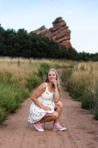 Littleton high school senior portrait photographer photography Colorado photo session Hildebrand Ranch South Valley Open Space park red rocks sunflowers barn sports sunset